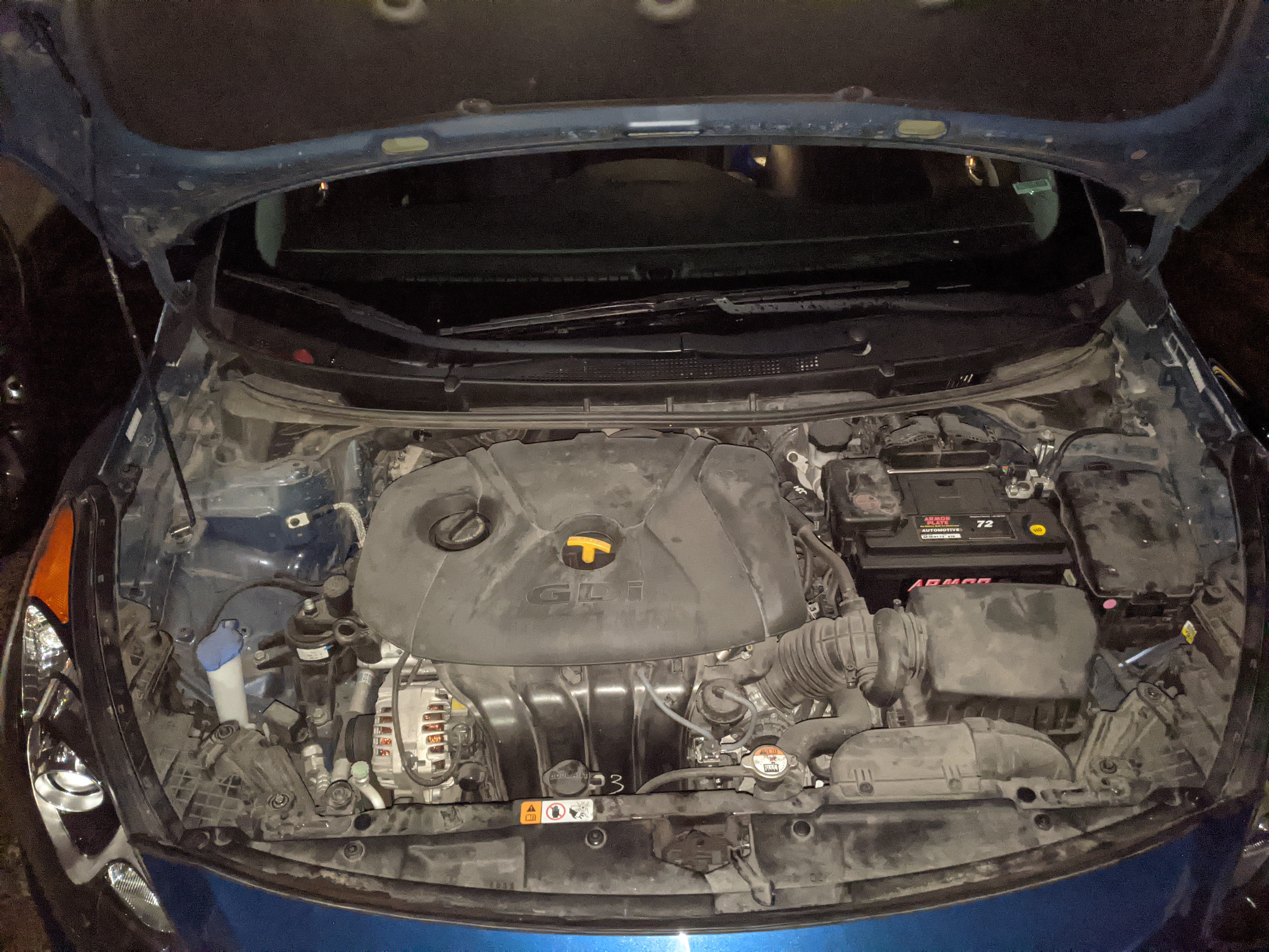 Historical engine bay before cleaning, showing dust and grime
